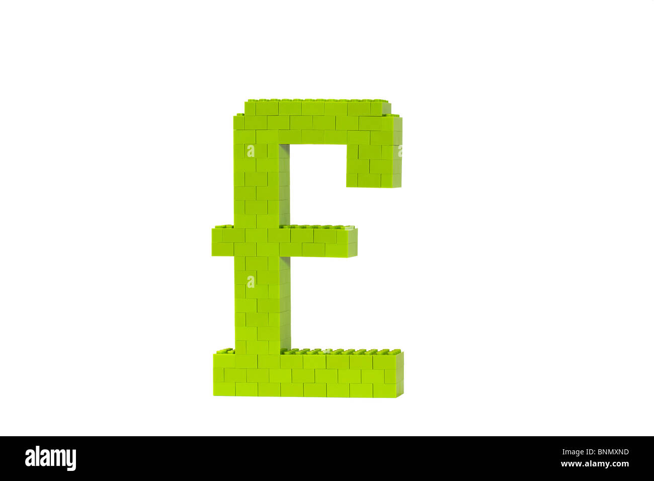 A green Pound symbol (GBP) constructed from toy bricks and shot against a white background at an angle to show it's 3D nature. Stock Photo