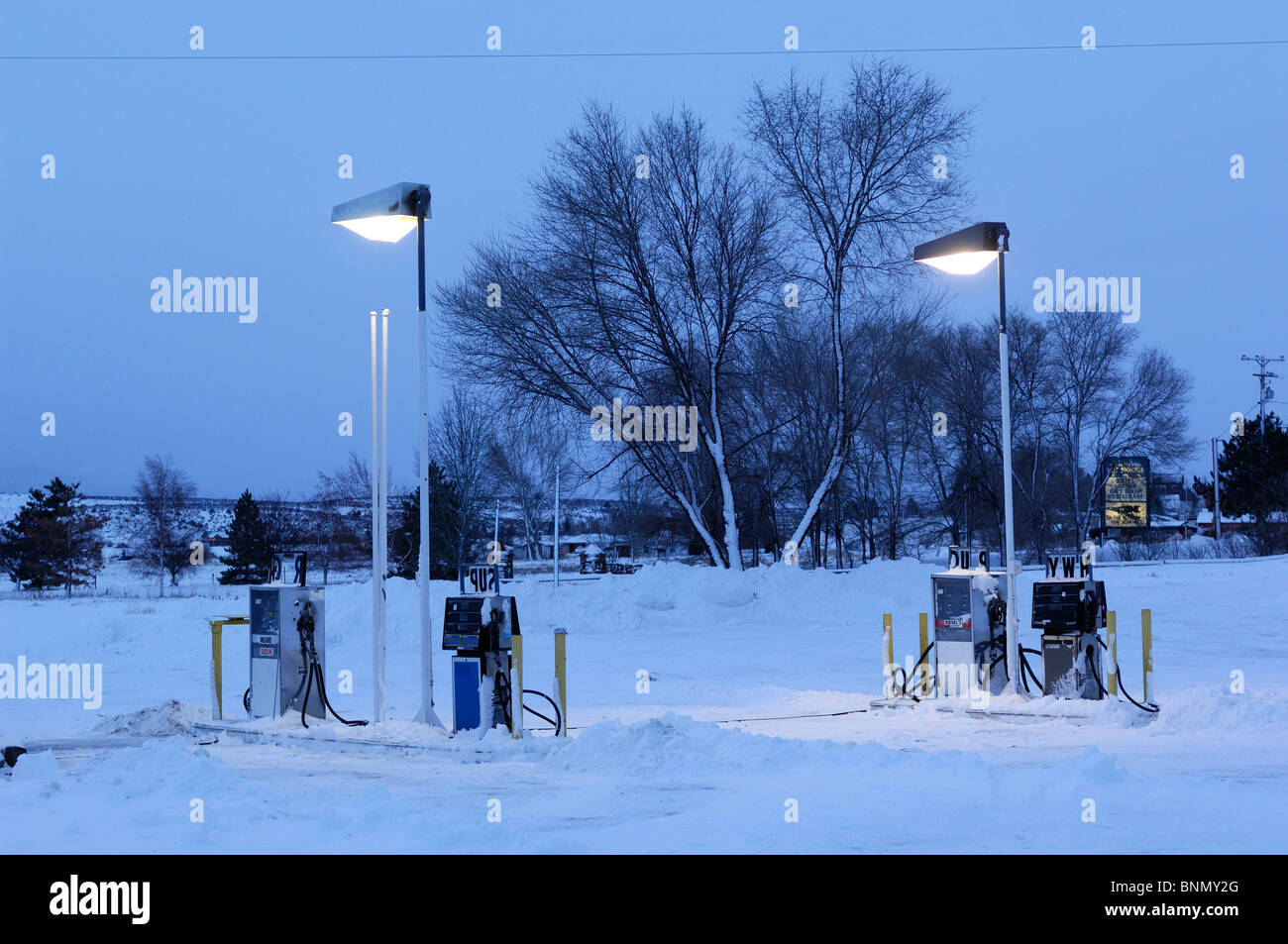 Snow covered Gas Station twilight Lakeview Oregon USA lanterns Stock Photo