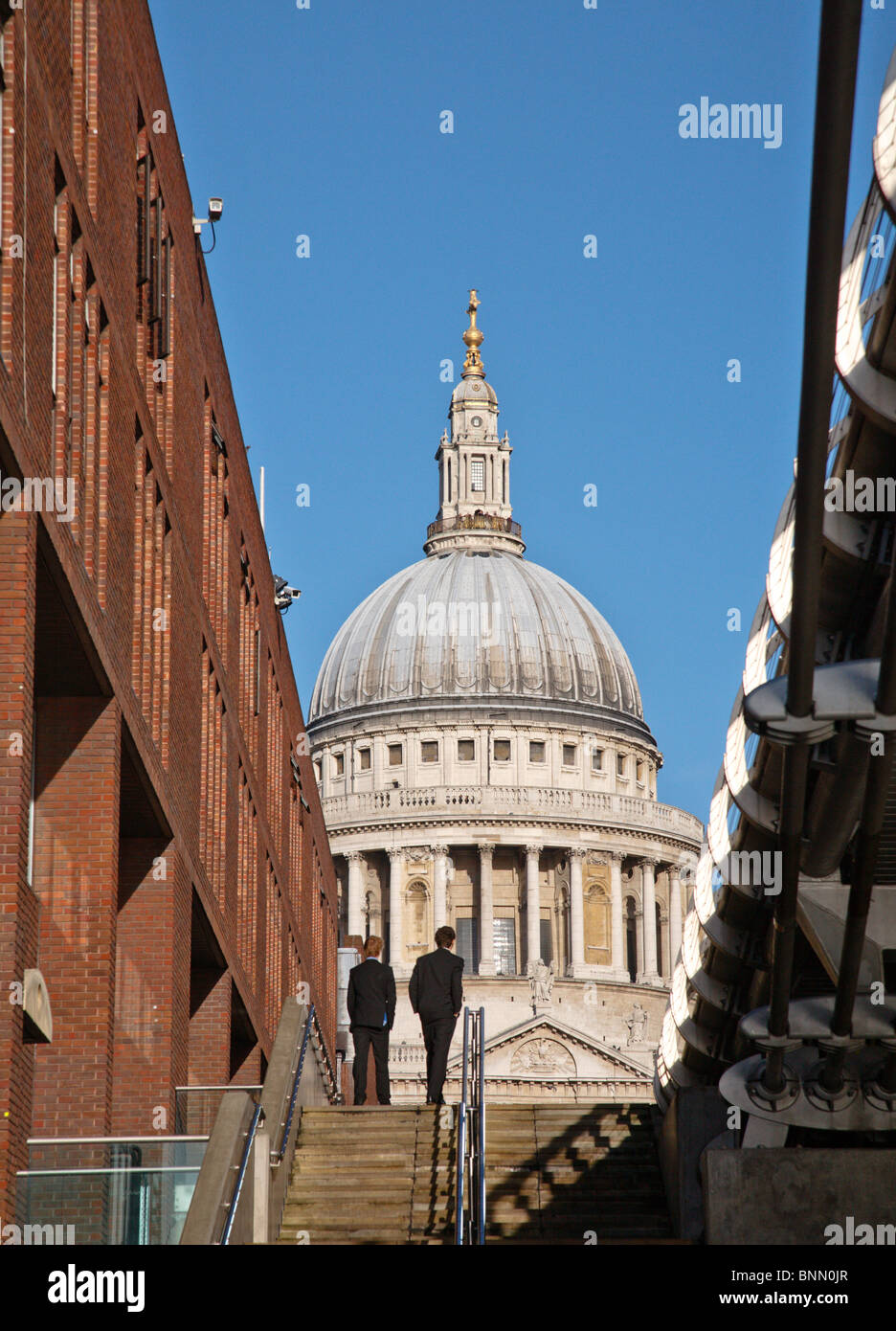 Two men in suits walk towards St. Paul's Cathedral Stock Photo