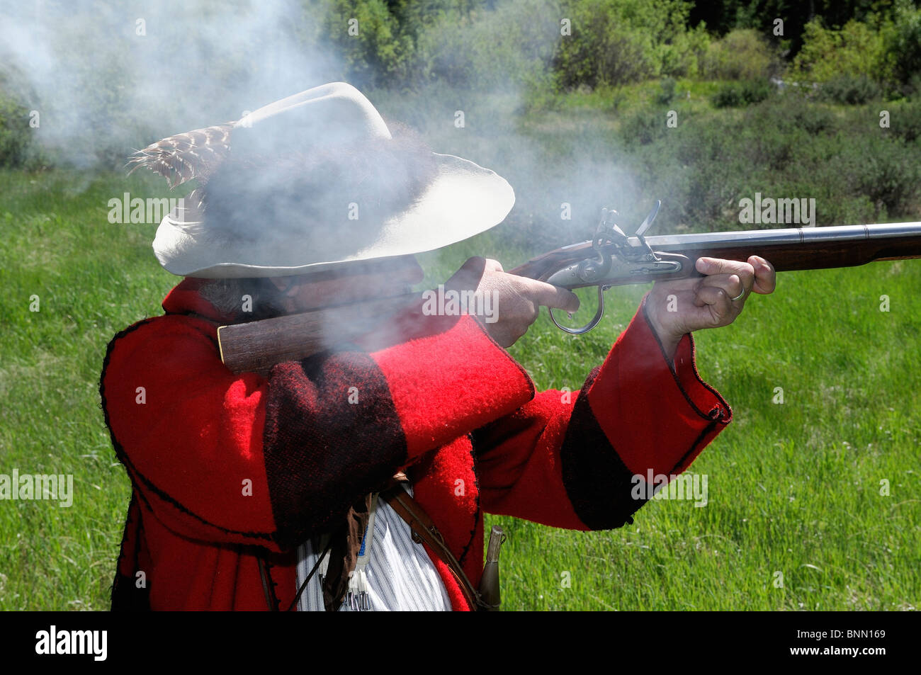 Re-enactor Steve Banks mountain man costume firing rifle Dubois Wyoming USA wild west Stock Photo