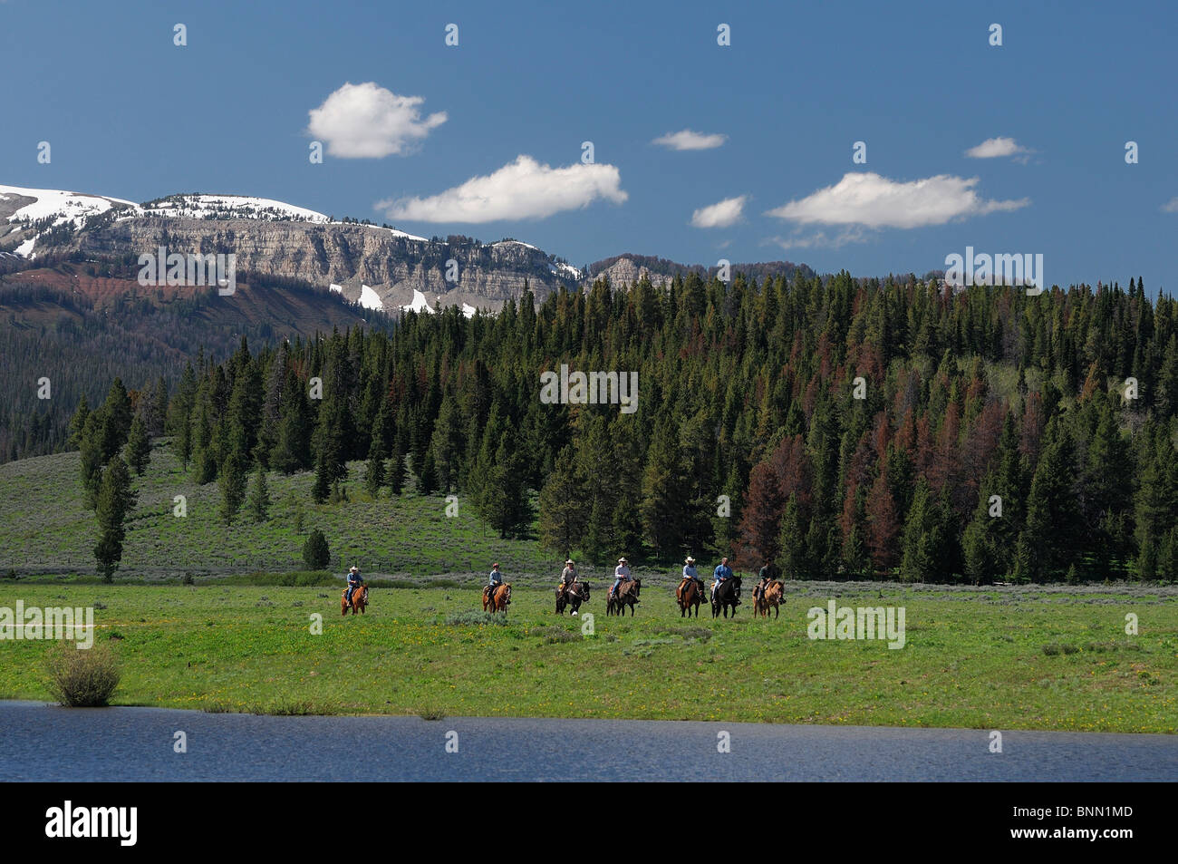 Horseback riders at Lake Flying A Ranch Pinedale Wyoming USA mountains