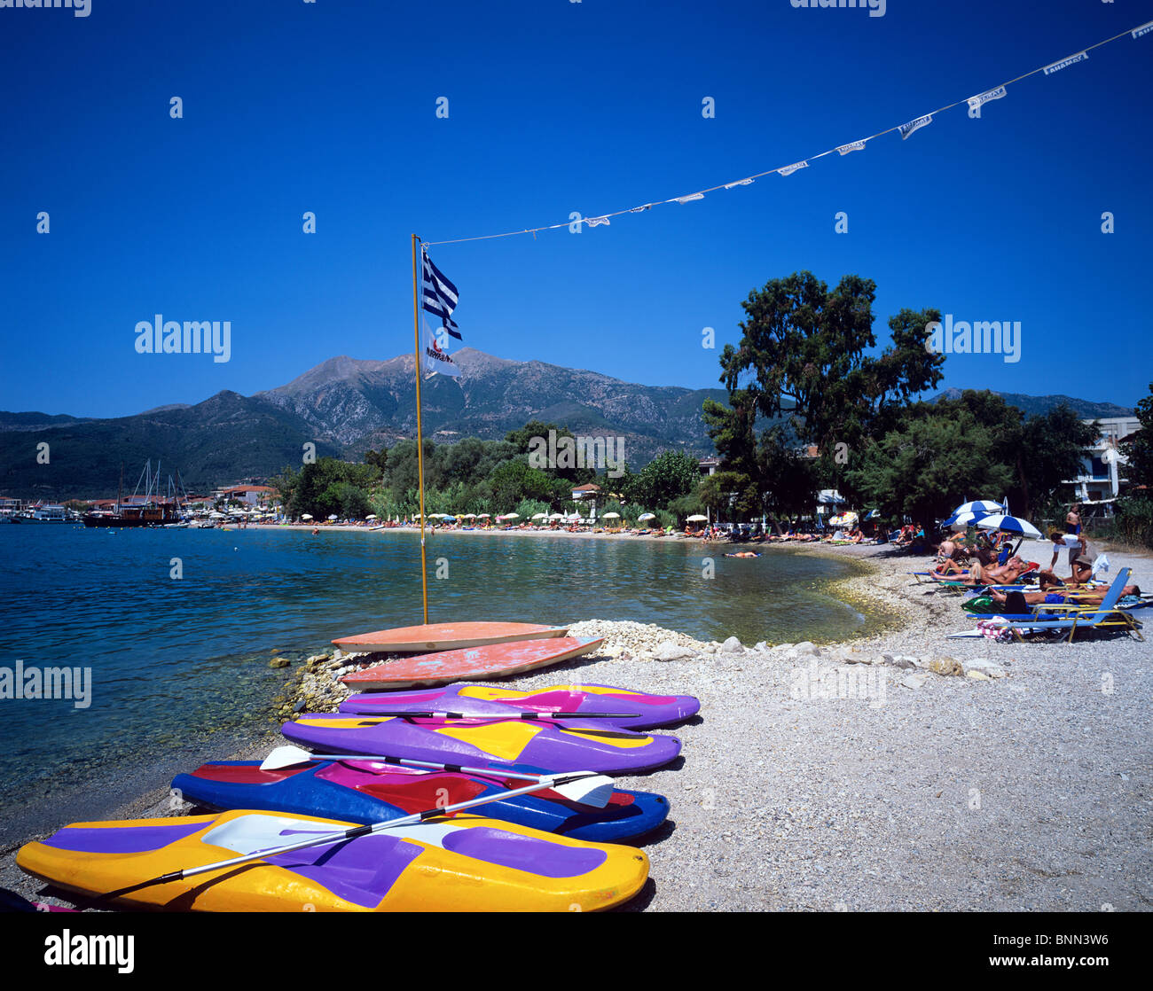 Canoes on the shore of Nidri Beach on the Greek island of Lefkas Stock Photo