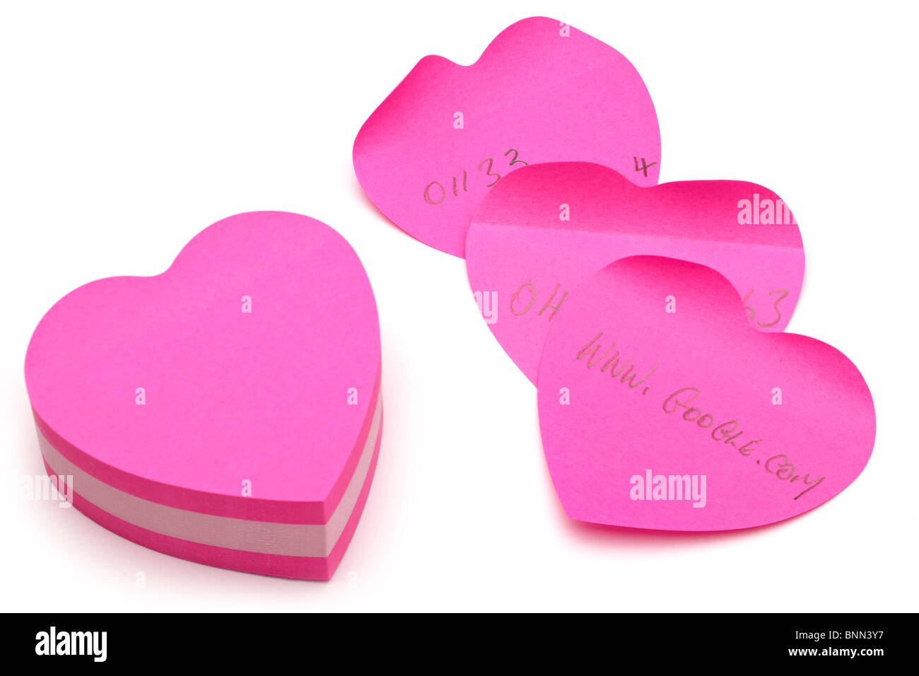 Heart shaped notepad and notes Stock Photo