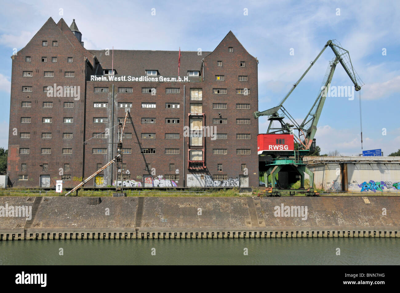 old architecture building Germany Duisburg harbour port building construction Germany transshipment of goods freight traffic Stock Photo