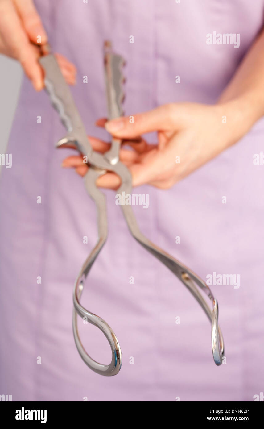 Midwife with obstetric forceps Stock Photo Alamy