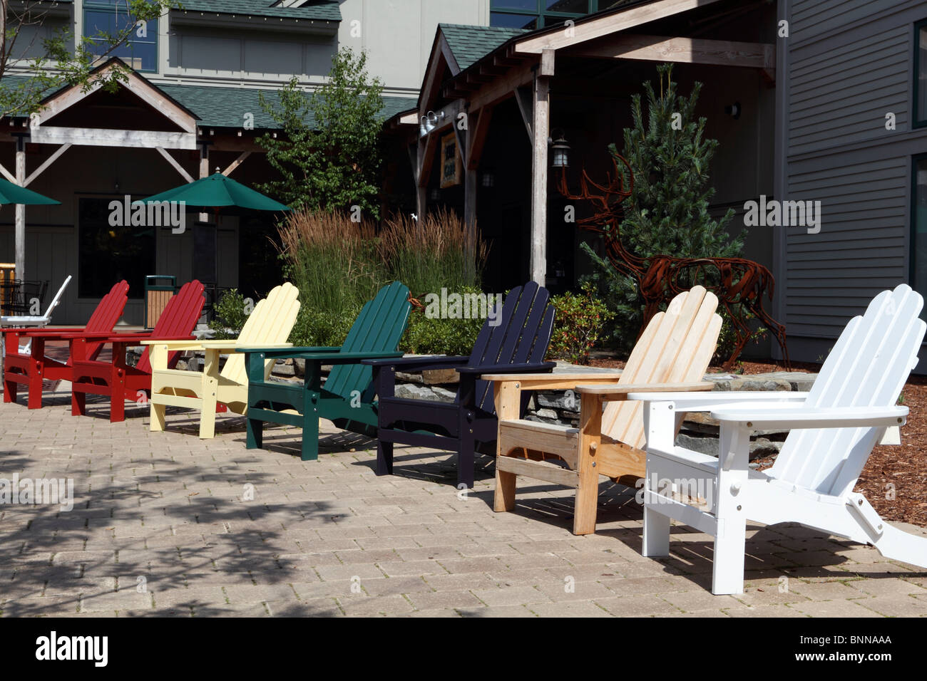 A colorful array of Adirondack wooden chairs outside the L.L. Bean