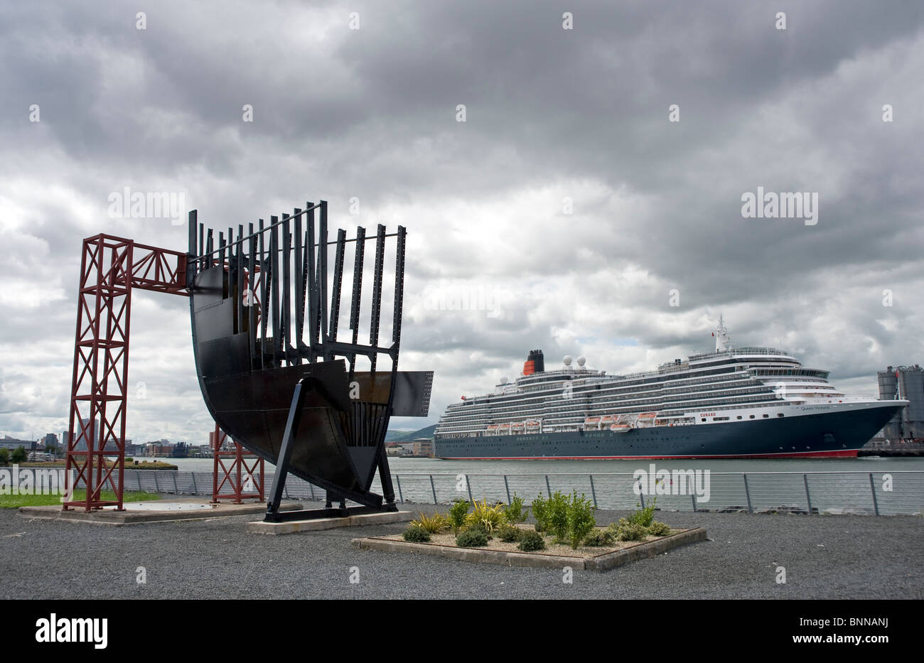 Cunard liner Queen Victoria is berthed opposite Belfast's Titanic visitor centre. Stock Photo