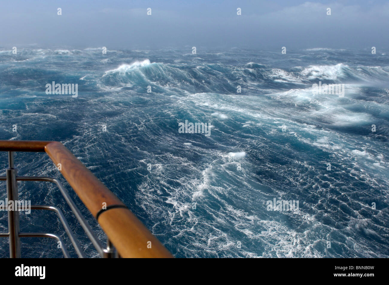 Antarctic Antarctica hurricane storm waves rail railing boat foam Stock Photo