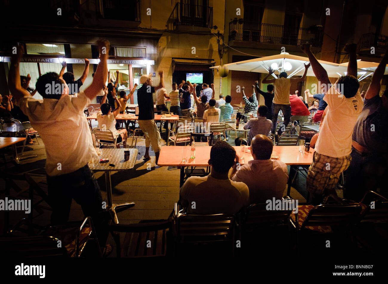 Spain scores the winning goal in the World Cup Final - July 2010 - as seen in a square in Manresa, Spain Stock Photo