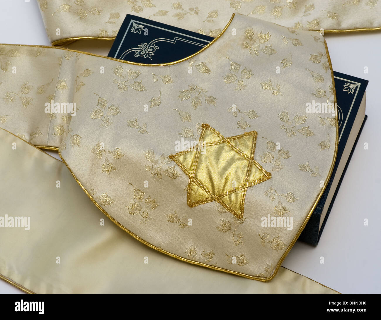 Gold Star of David tapestry on Bible representing Judaism Stock Photo