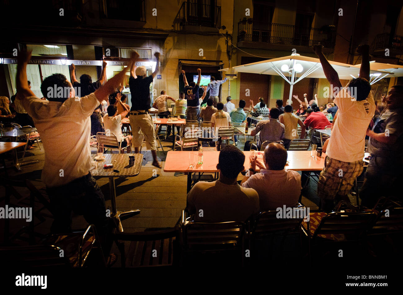 Spain scores the winning goal in the World Cup Final - July 2010 - as seen in a square in Manresa, Spain Stock Photo