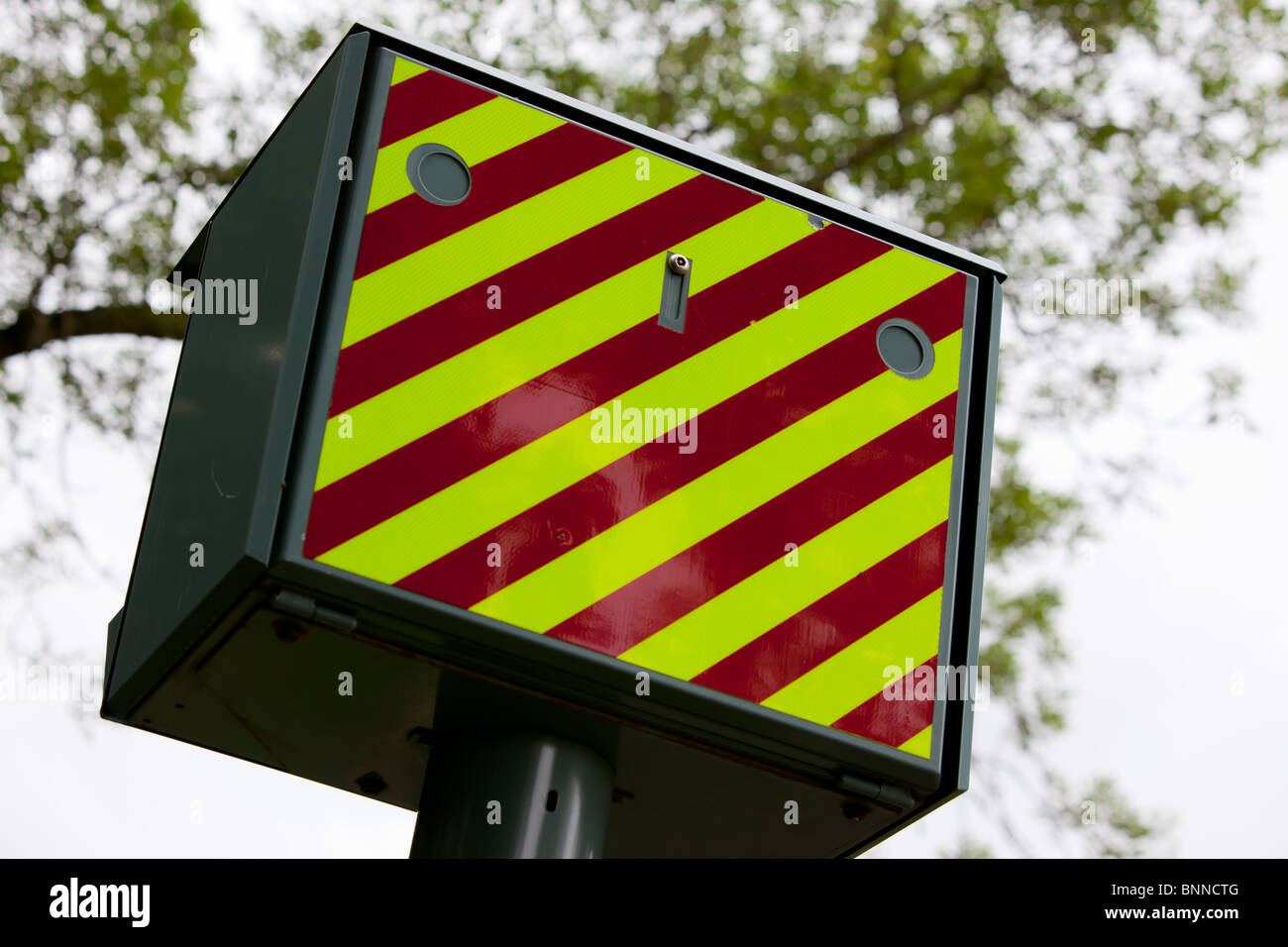 The back of a GATSO speed camera pointing up a road Stock Photo
