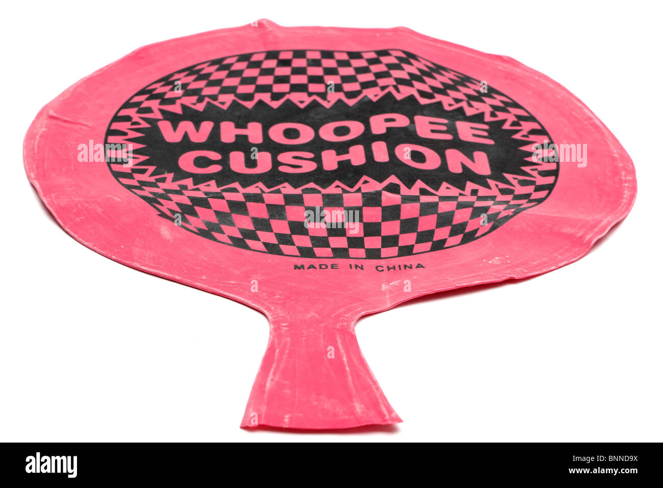 Deflated rubber whoopee cushion made in china Stock Photo