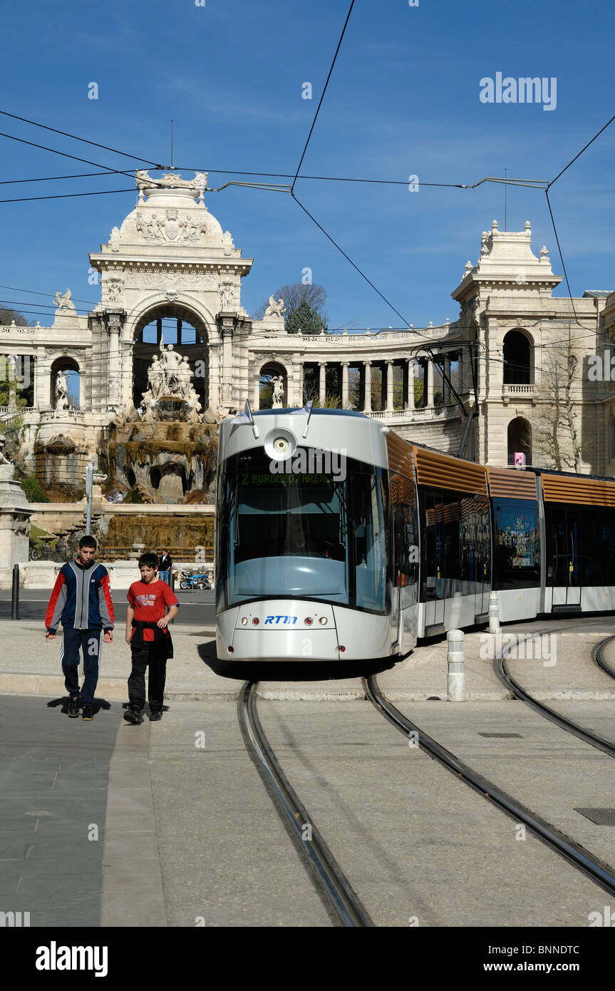 Two Boys & a Tram in front of Palais Longchamp Château d'Eau (designed by Henri Espérandieu),  Marseille or Marseilles, France Stock Photo