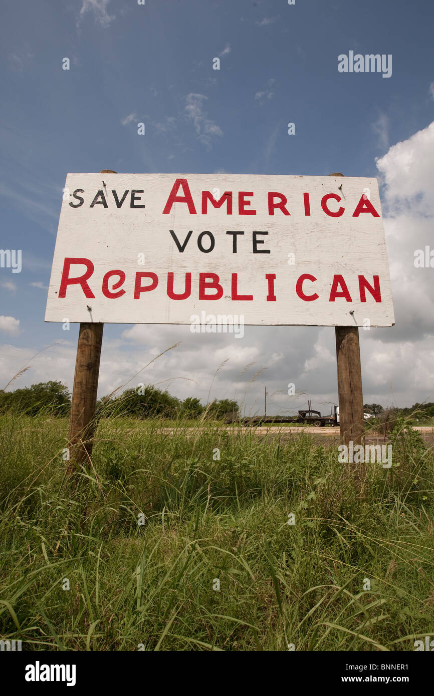 A hand-painted plywood sign urging passers-by to vote Republican stands alongside the highway in Marquez, Leon County in east TX Stock Photo