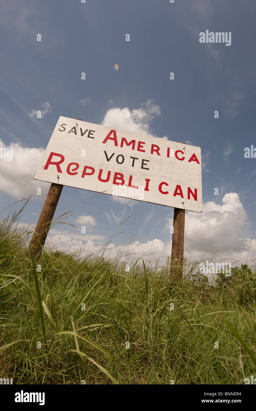 A hand-painted plywood sign urging passers-by to vote Republican stands alongside the highway in Marquez, Leon County in east TX Stock Photo