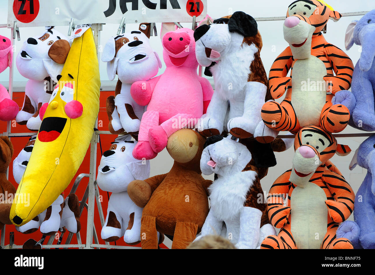 large cuddly toys as prizes on a tombola stall at a fairground, england, uk Stock Photo