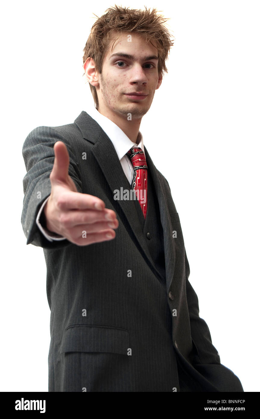 Attractive Young Businessman Greets the view With A Smile And A Handshake. Isolated on white background. Stock Photo