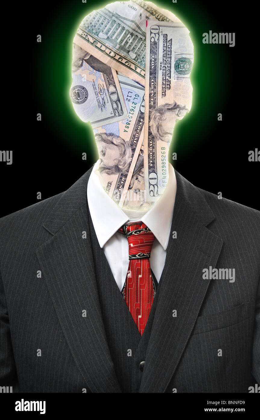 Head silhouetted figure with cash inside of his head. He is wearing a black business suit with a red tie. Stock Photo