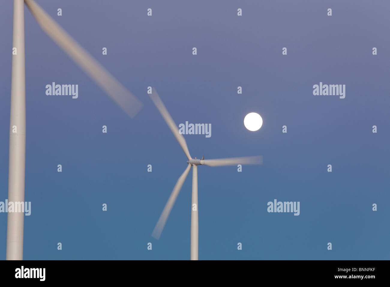 Wind Turbine, full moon. Stock Photo