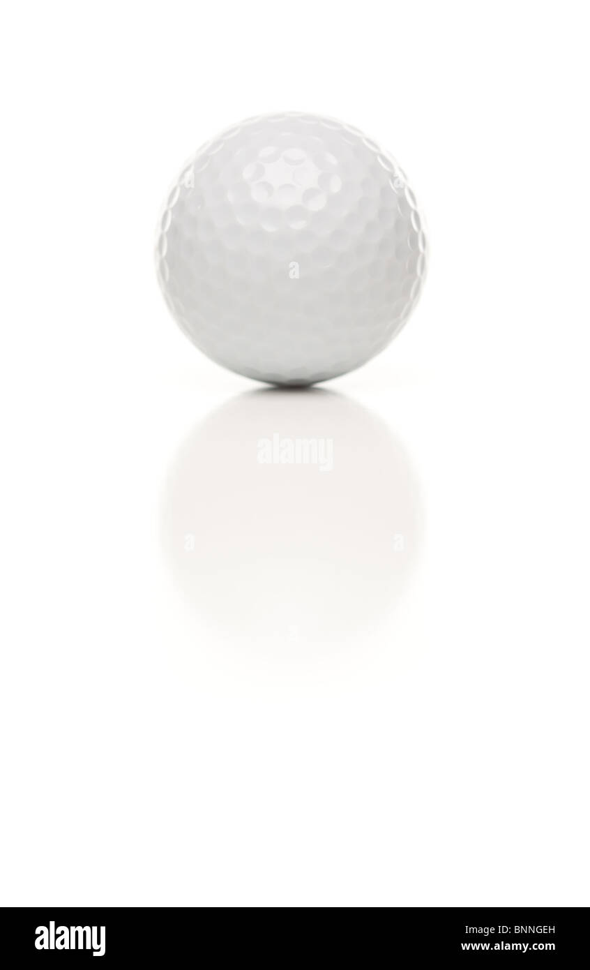 Single White Golf Ball Isolated on a White Reflective Background. Stock Photo