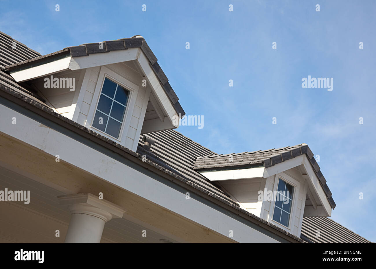 Abstract House Facade and Windows Against a Blue Sky Stock Photo - Alamy
