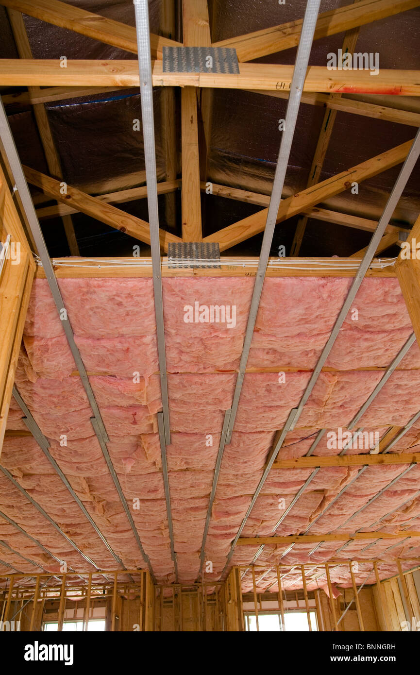 pink bats ceiling insulation in new home Stock Photo
