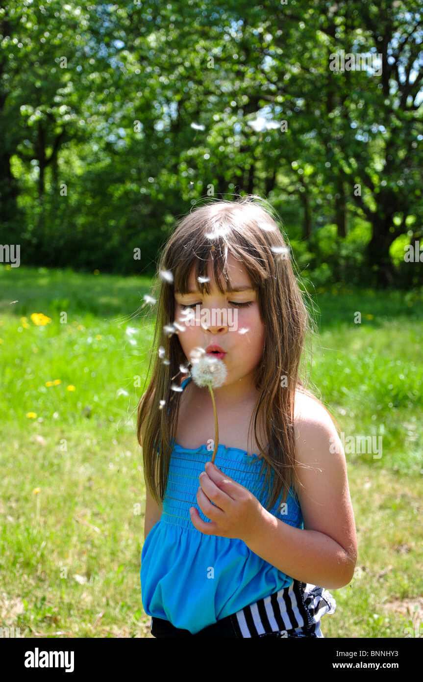 little girl closeup portrait with dandelion Stock Photo - Alamy