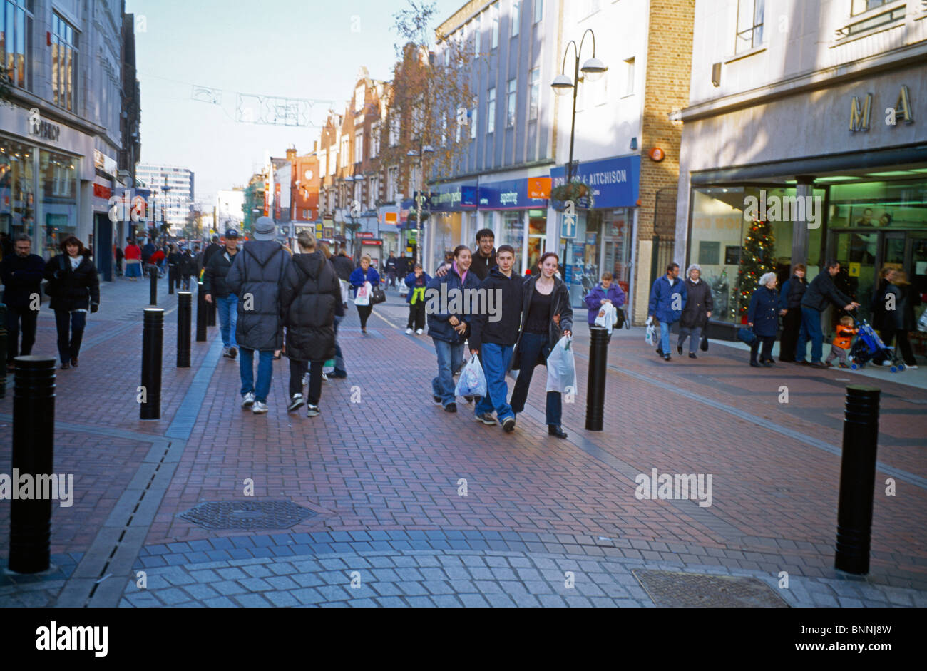Crowds Of People Shopping In High Street Sutton Surrey England Stock Photo