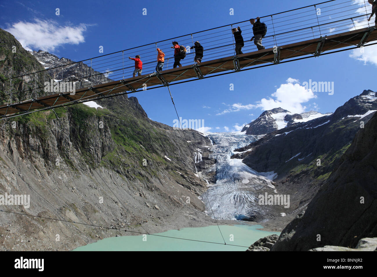 Switzerland swiss walk hike group family Trift glacier bridge glacier
