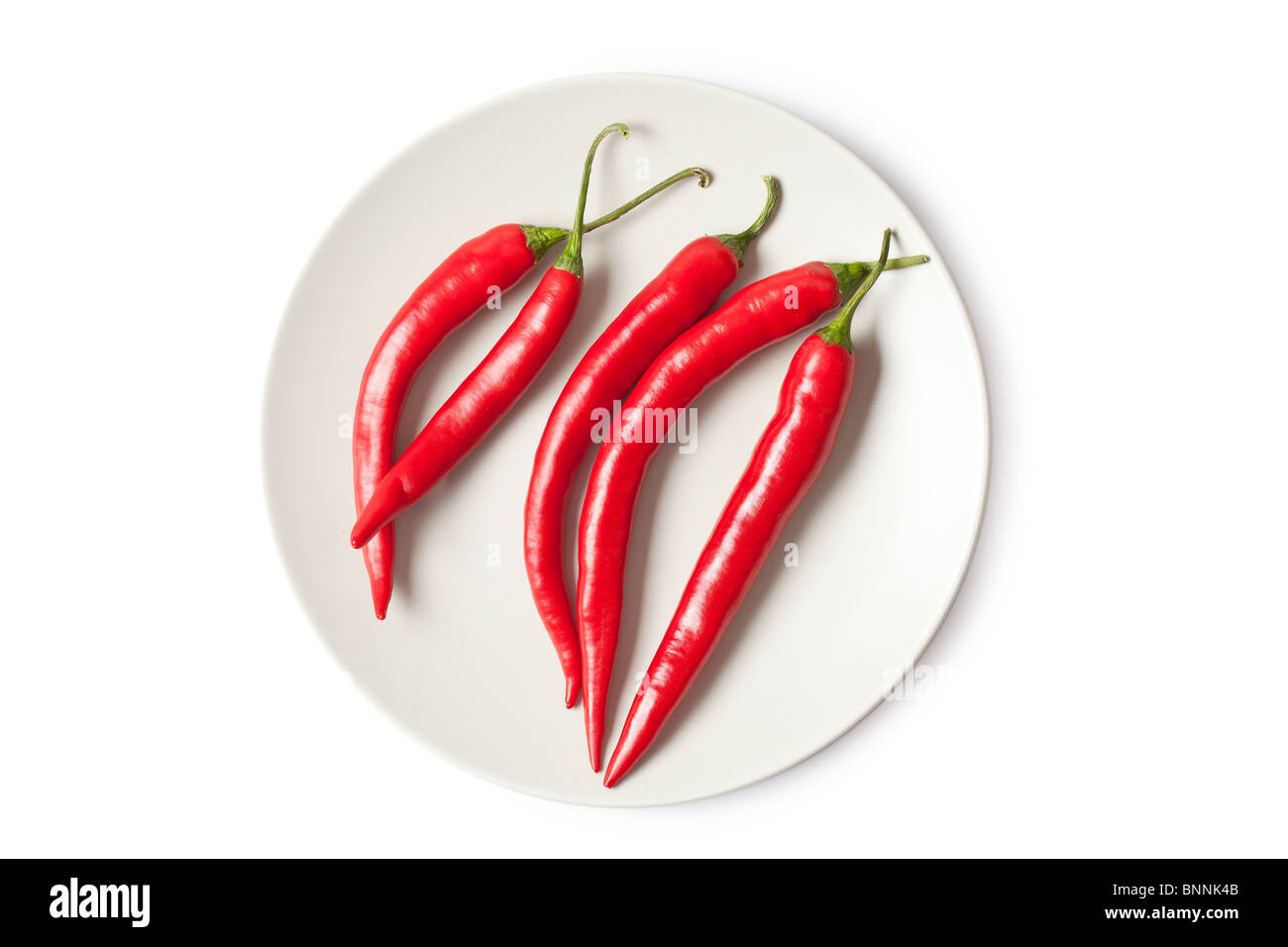 red chili peppers on white background Stock Photo - Alamy