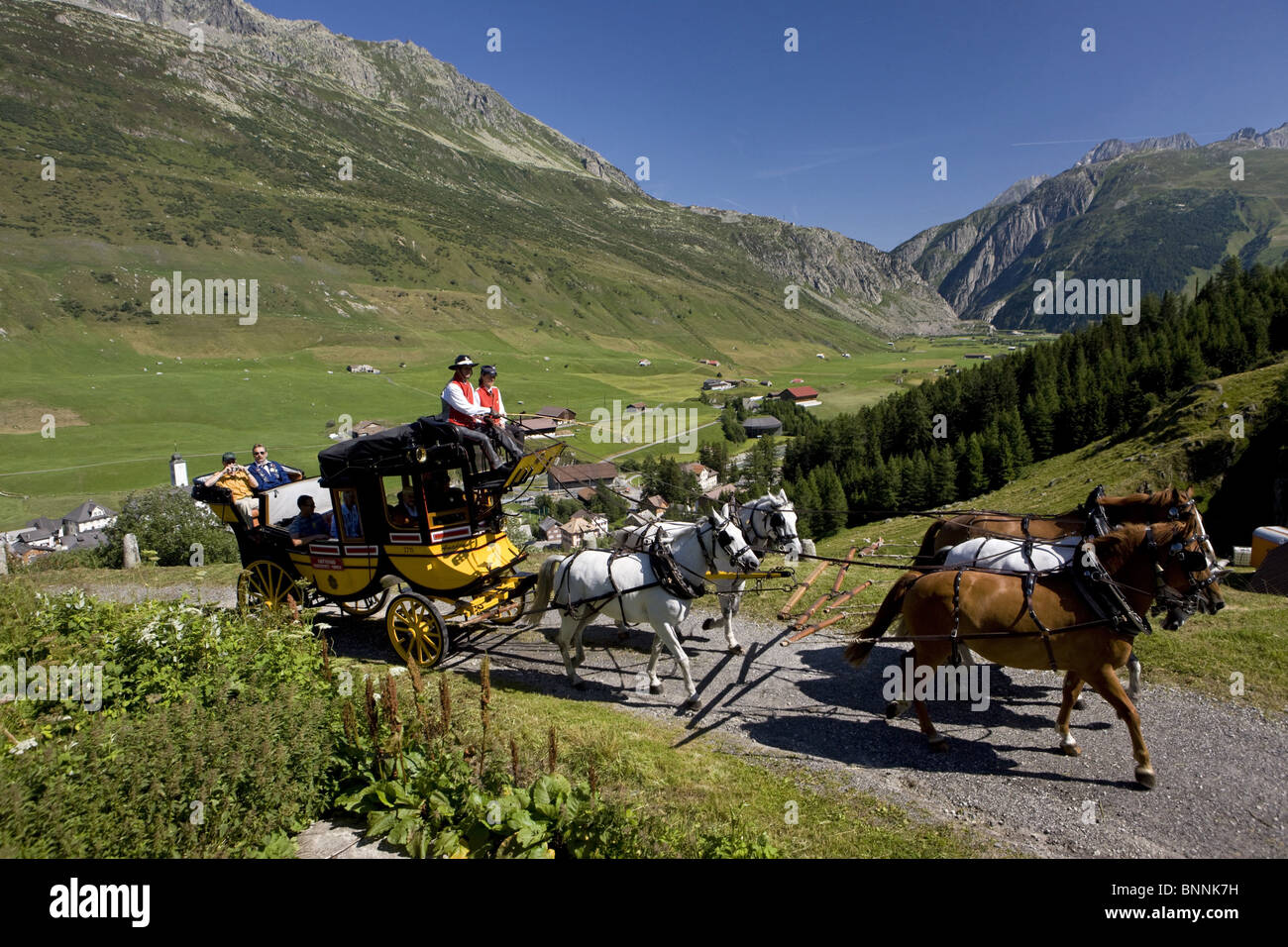 Switzerland swiss Gotthard stagecoach stagecoach team pair horses tourists coachmen Hospental canton Uri scenery Stock Photo