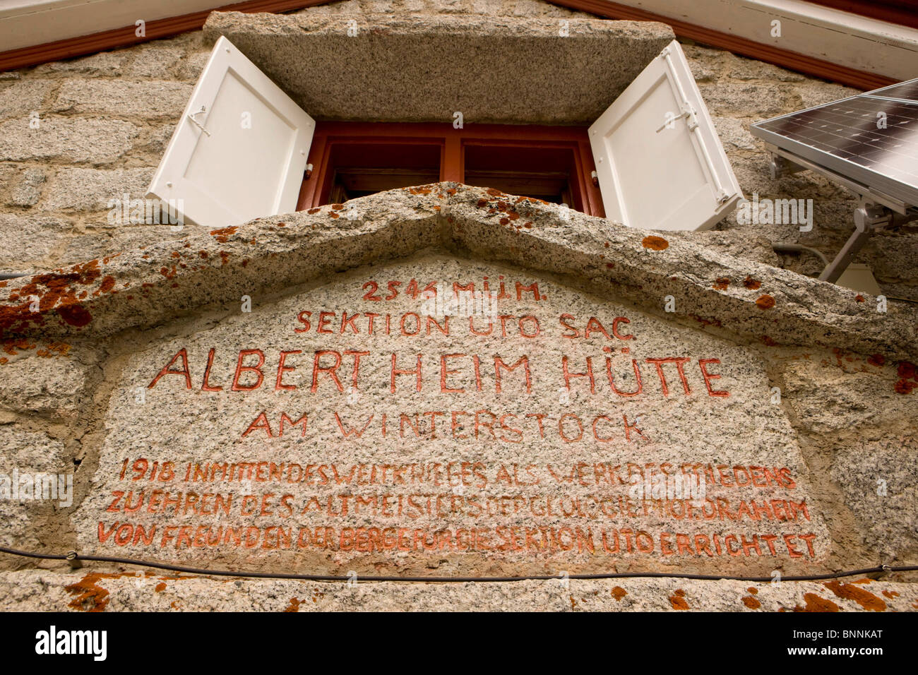 Switzerland swiss Albert Heim Hütte detail stone board window shutters facade mountains alpine Alps Furka area field mountains Stock Photo