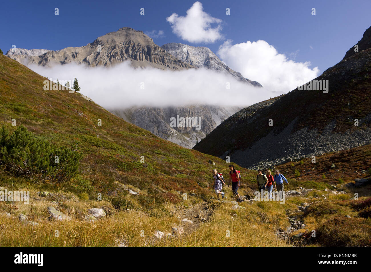 Switzerland swiss walking hiking Fuorcla Crap Alv Albulapass family mountains nature footpath canton Graubünden Grisons Stock Photo