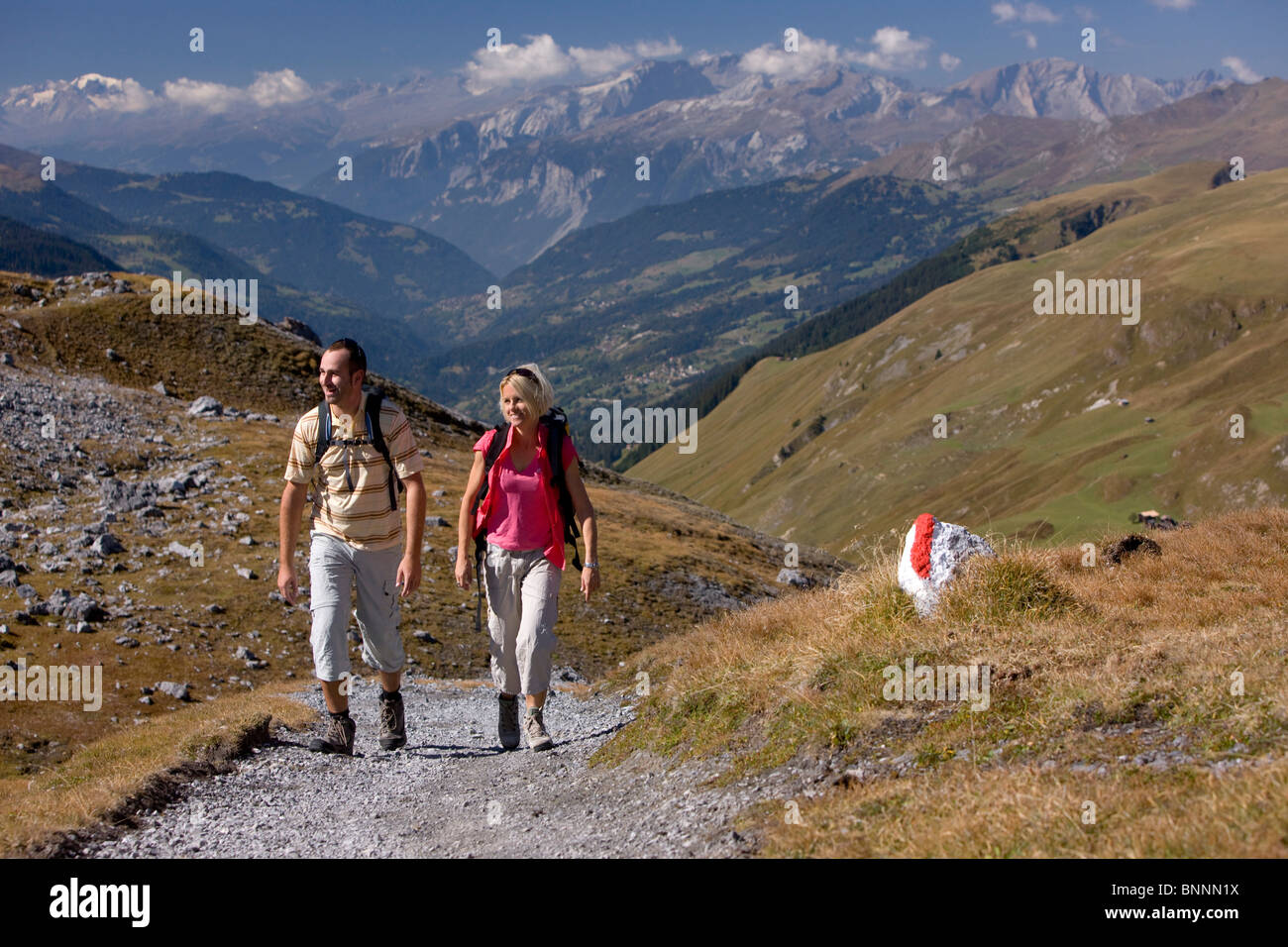 Switzerland swiss autumn walk hike two pair couple Strelapass Davos mountains canton Graubünden Grisons Bündnerland persons Stock Photo