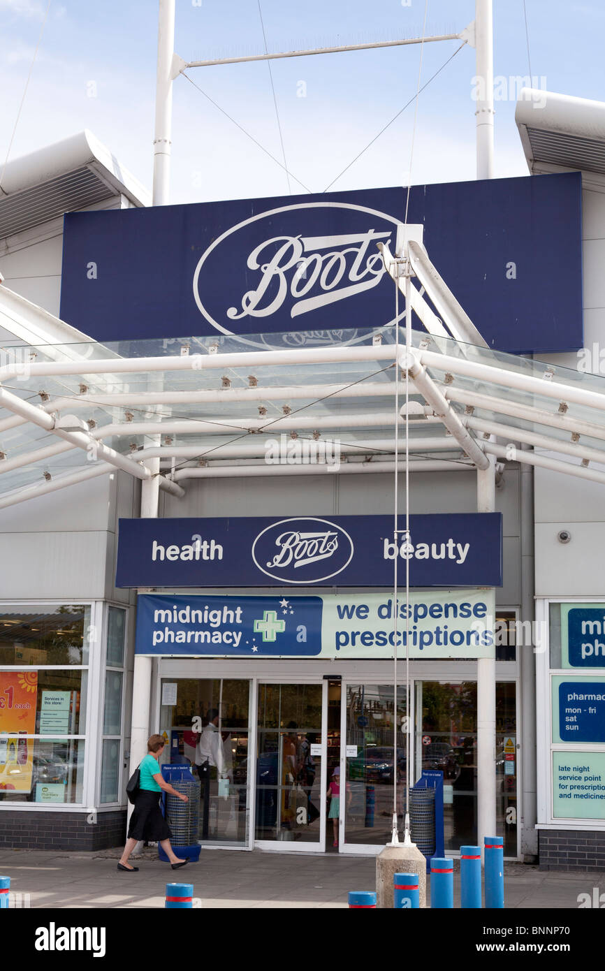 Boots entrance to store and company logo sign at West Quay, Southampton Stock Photo