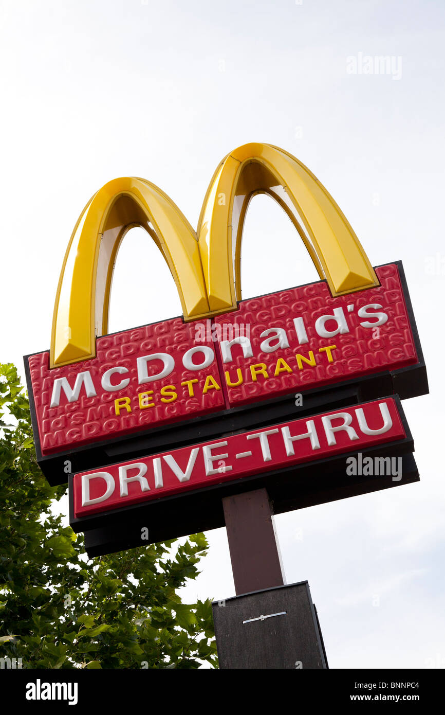 McDonald's sign and company logo on post with drive-thru signat West Quay, Southampton Stock Photo