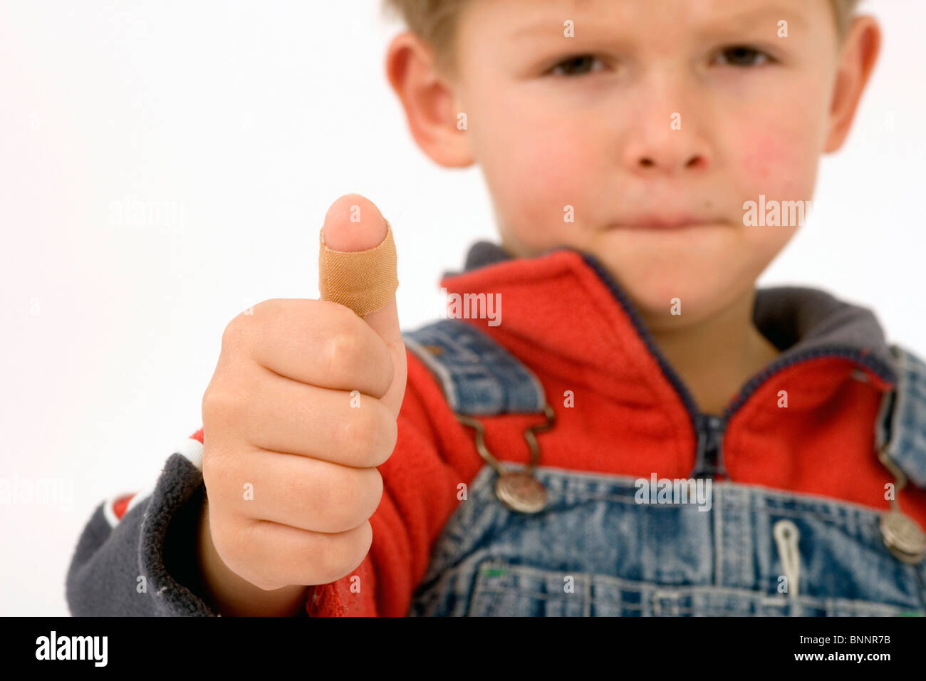 Boy boy five-year-old five-year-old injury violation plaster sadly pain ache Stock Photo