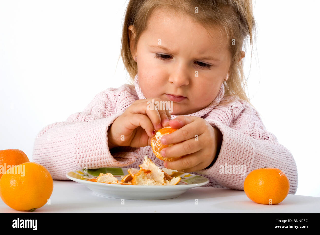 three-year-old girls child Mandarine fruit food feeding healthy health