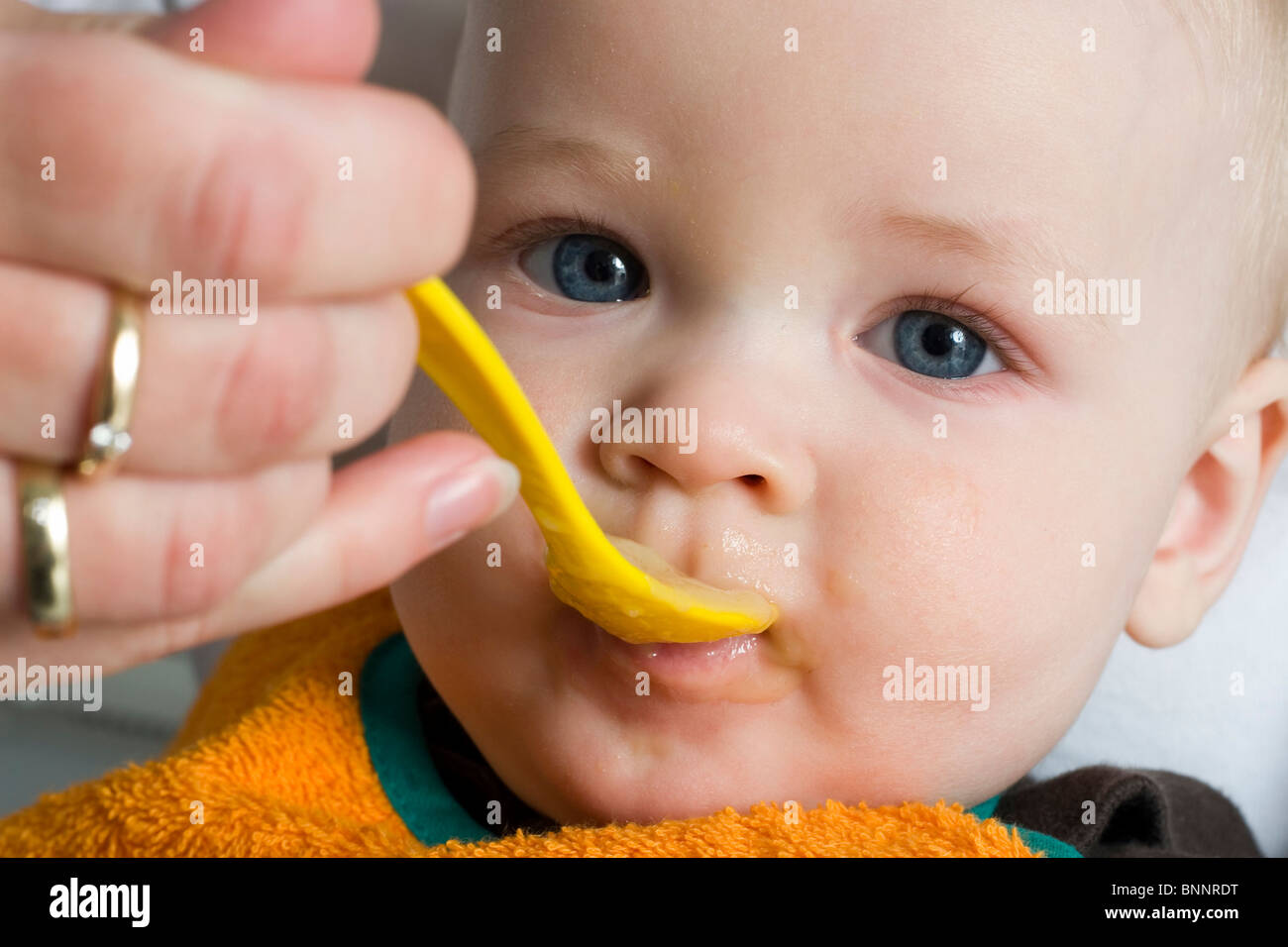 Baby child boy mash porridge eat feed food feeding one-year-old one