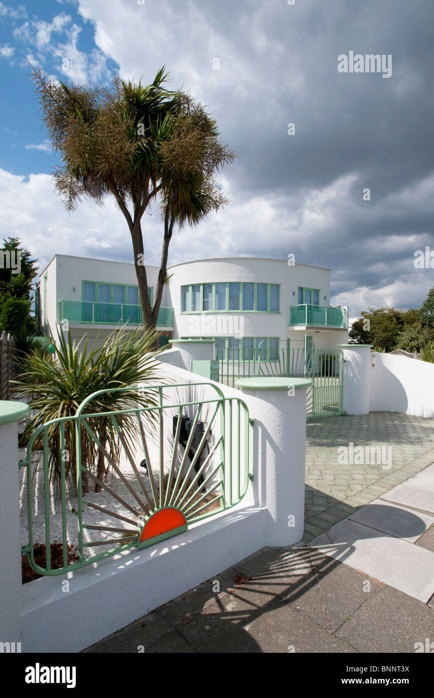 Art deco house with curved white walls and distinctive sunrise railings