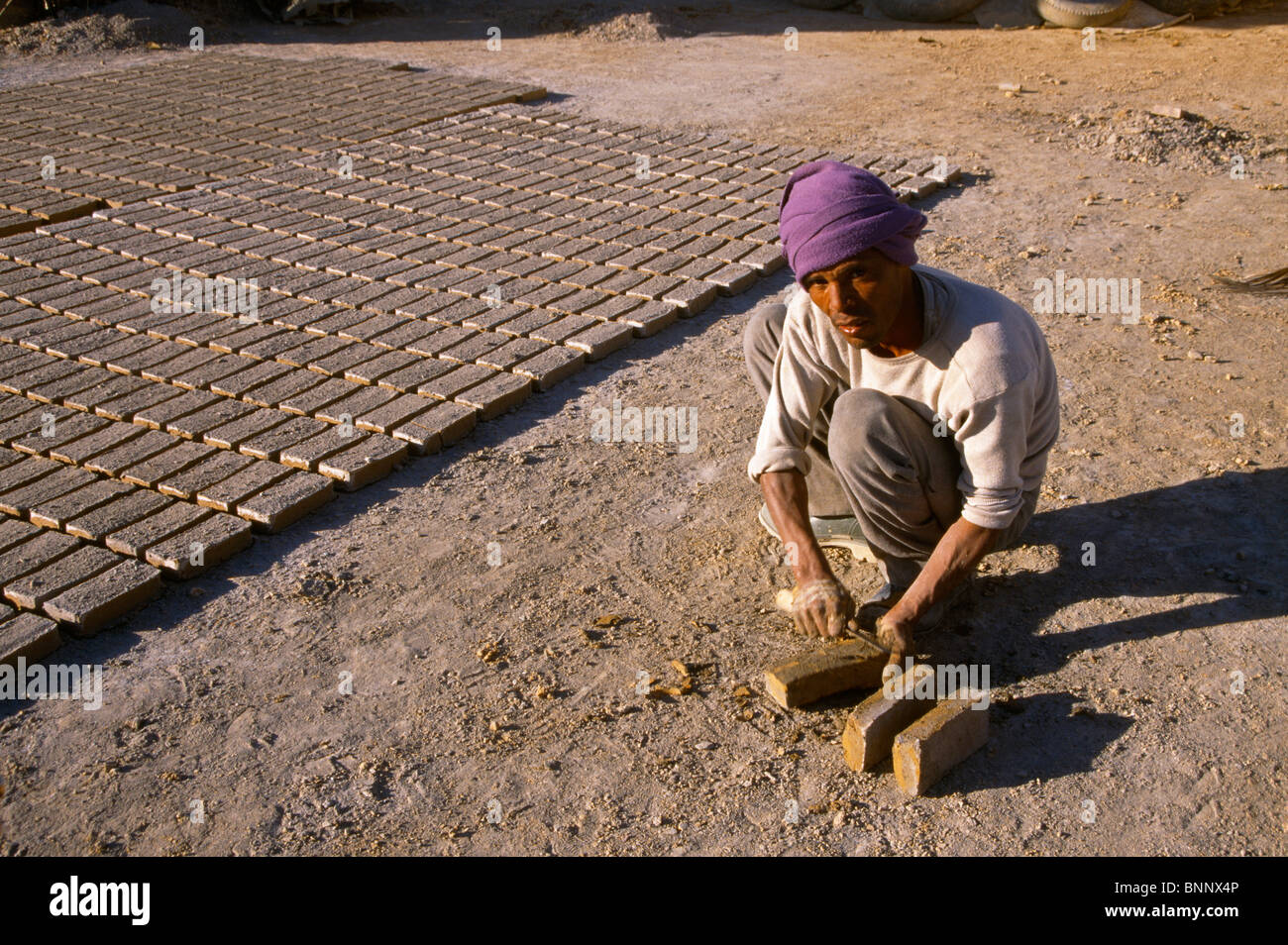 Nefta Tunisia Forming Mud Bricks & Drying Them In Sun Stock Photo