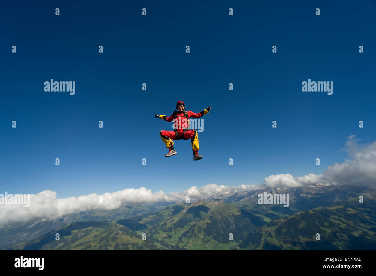 Skydiver are flying head up position over a spectacular mountain ...