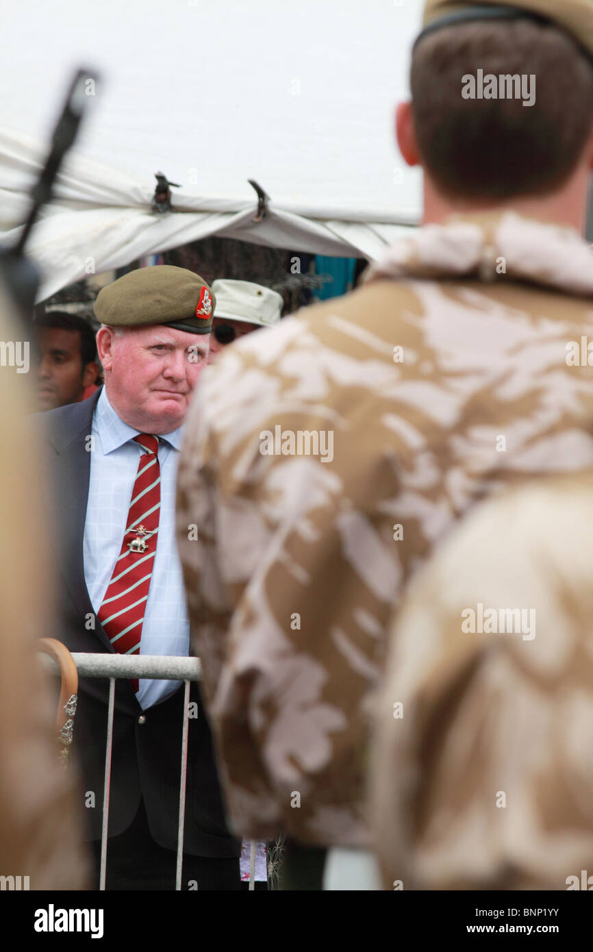 a retired serviceman looks on with pride at troops of the Yorkshire Regiment during the Freedom Parade in Skipton, Yorkshire Stock Photo