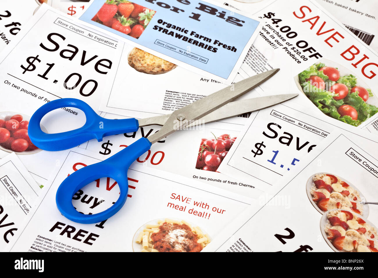 Fake coupon background with Scissors. All coupons were created by the photographer. Images in the coupons are the photographers Stock Photo