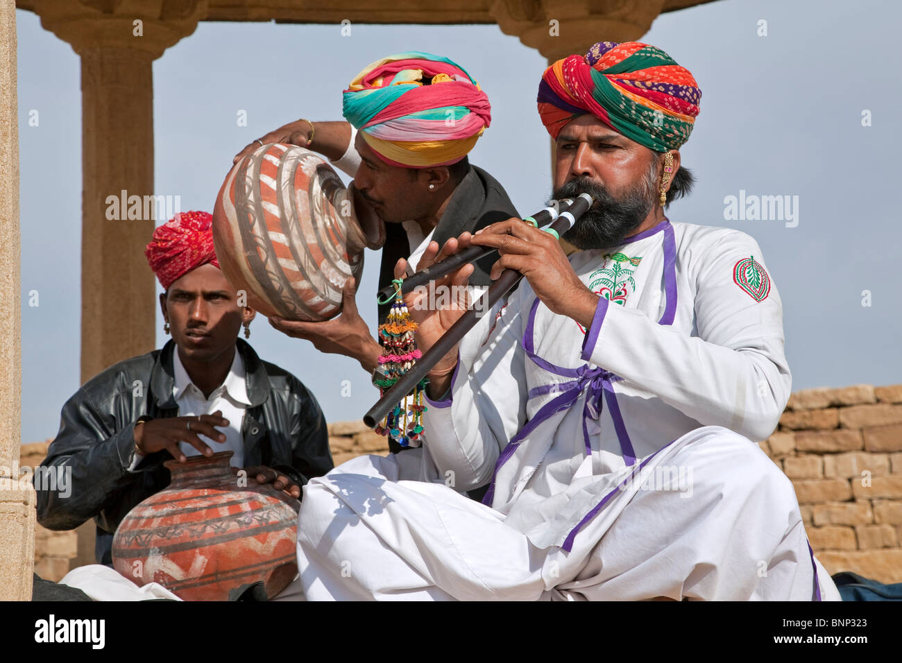 Indian men playing traditional music. Khuri village. Near Jaisalmer ...