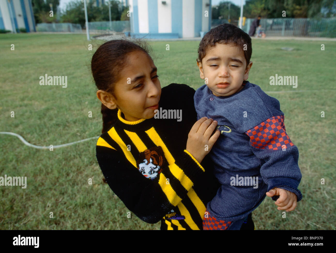 Kuwait City Kuwait Girl Holding Baby Brother Stock Photo Alamy