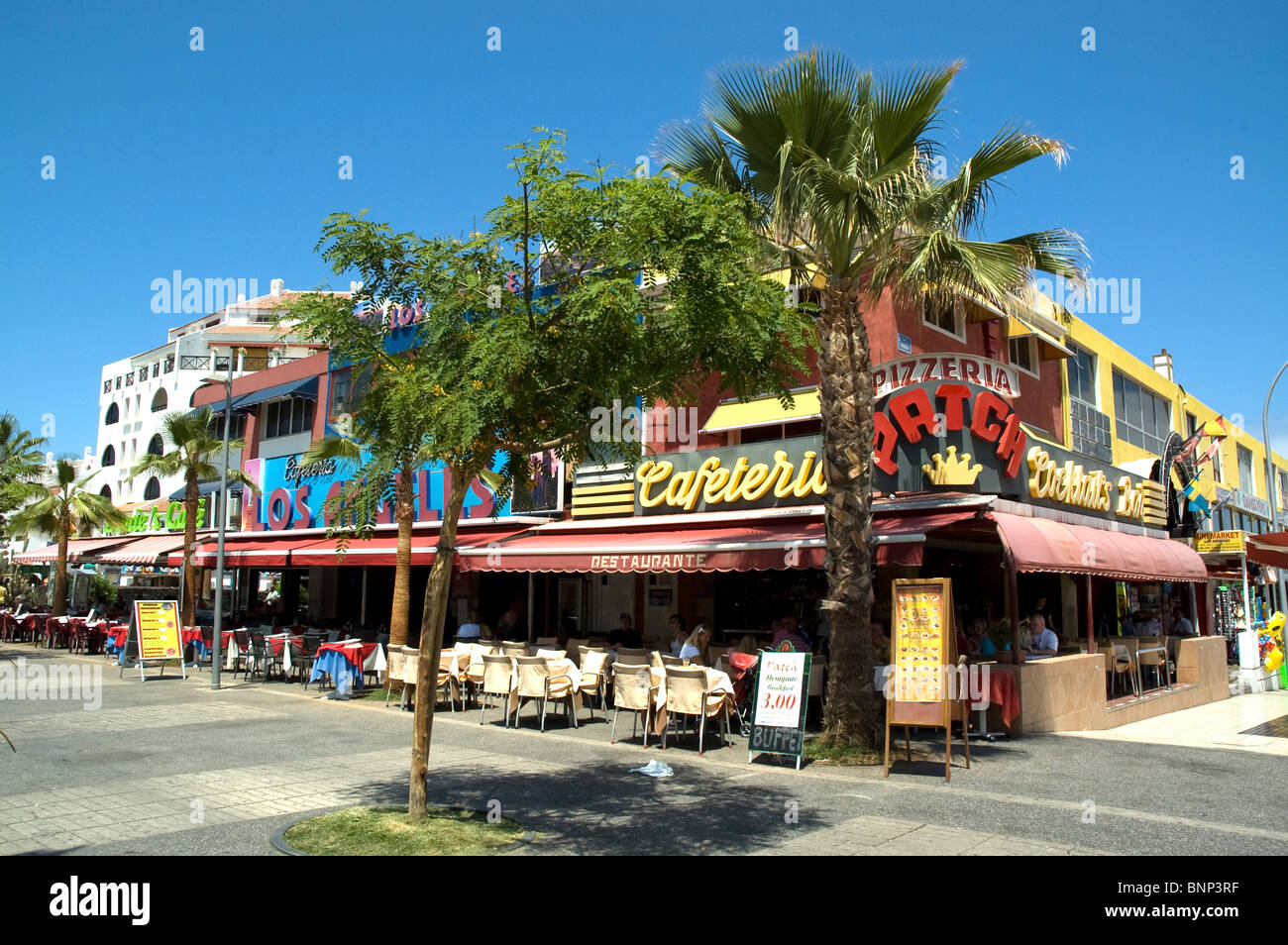 Bars and restaurants in Abenue Rafael Puig Tenerife - Playa de las Americas  Stock Photo - Alamy