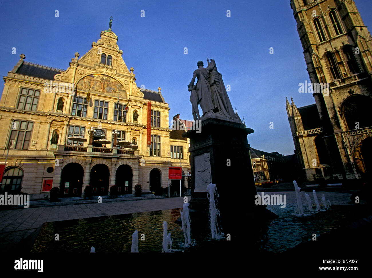 Schouwburg Theatre, left, Saint Bavo Cathedral, right, city of Ghent, Ghent, East Flanders, East Flanders Province, Belgium, Europe Stock Photo