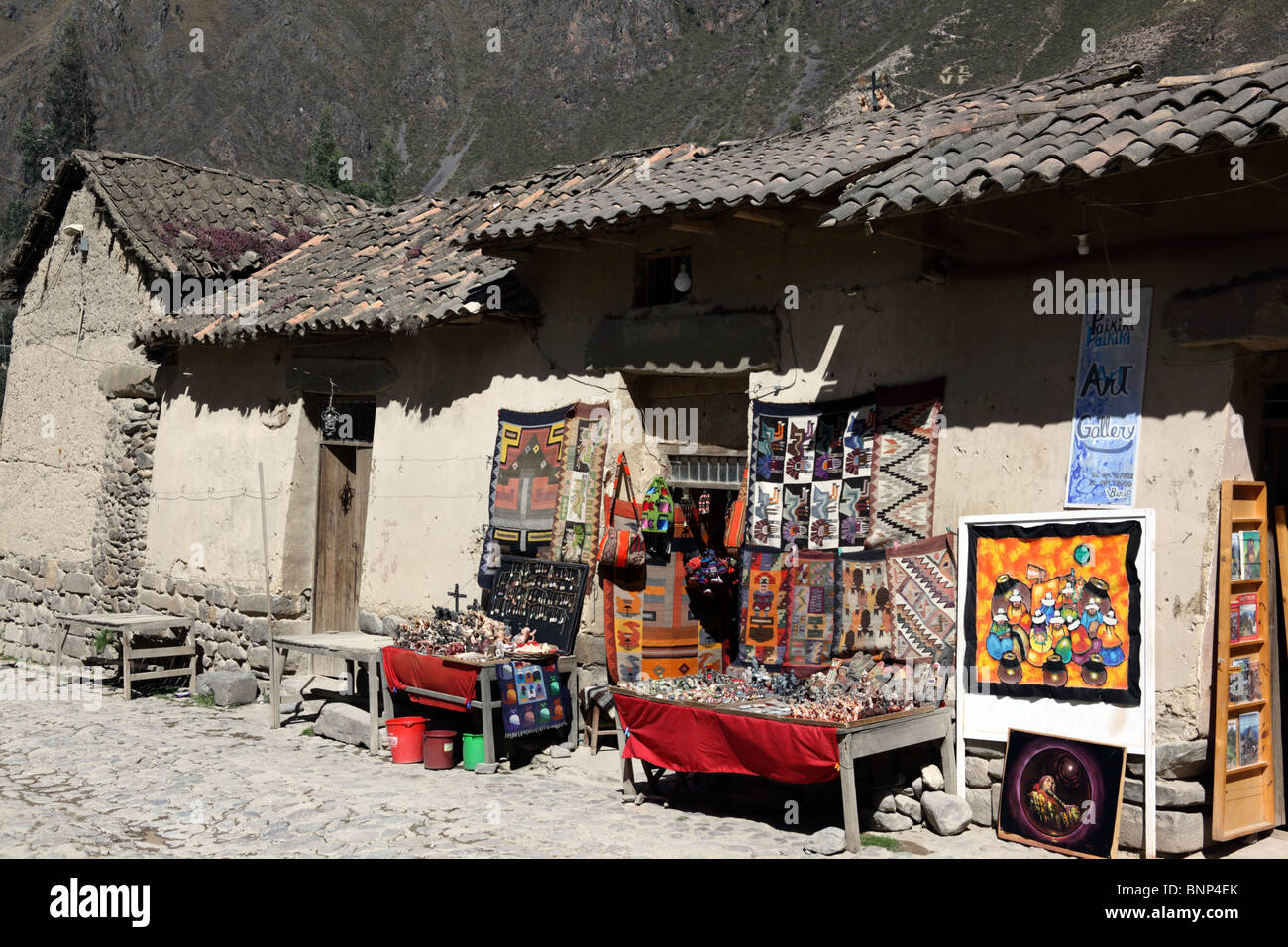 Souvenirs for sale outside rustic shop in village of Ollantaytambo